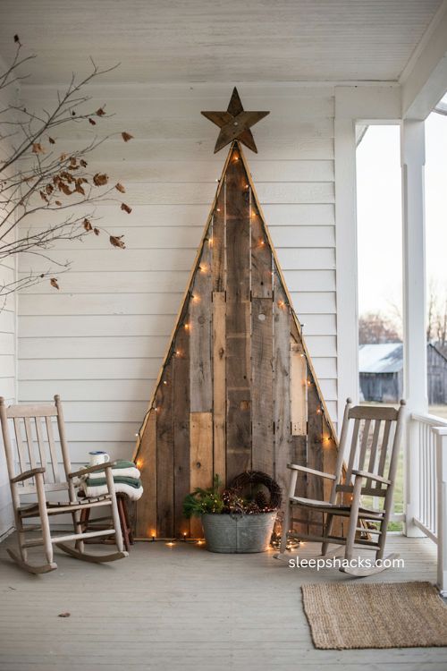 Full size pallet wood christmas tree with rustic star and cozy farmhouse porch decor 