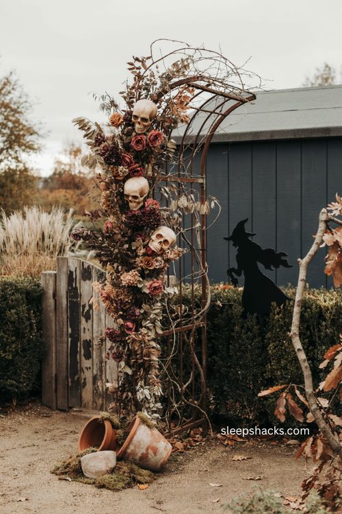 Giant skulls in gothic garden arch with dark foliage Halloween decor
