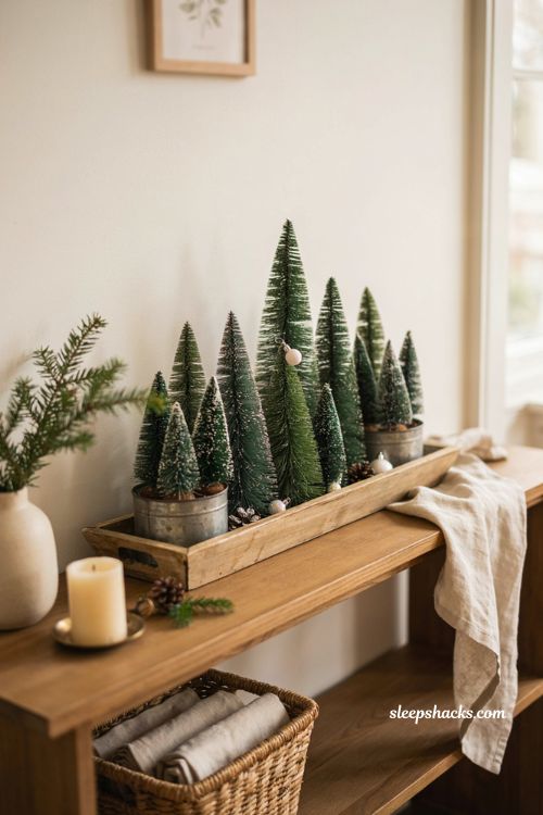 Green Christmas decor ideas with bottle brush trees in wooden tray
