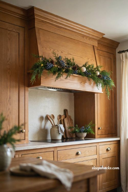 Green Christmas decor ideas with juniper garland on range hood