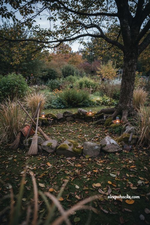 Halloween garden ideas with witches circle stones broomsticks and mystical lanterns