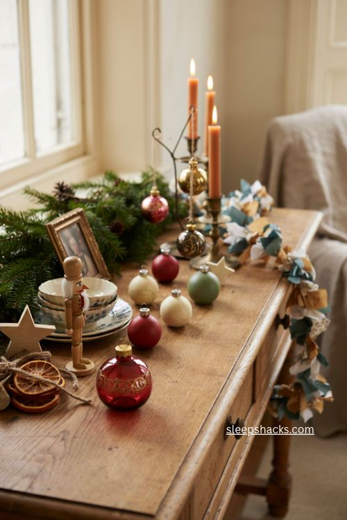 Handmade family Christmas sideboard decor with heirloom ornaments and greenery