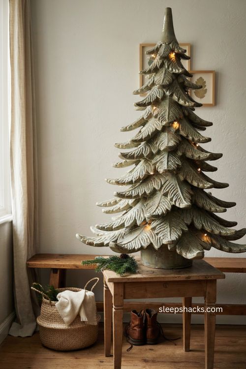 Large statement ceramic christmas tree as a focal point in a cozy entryway 