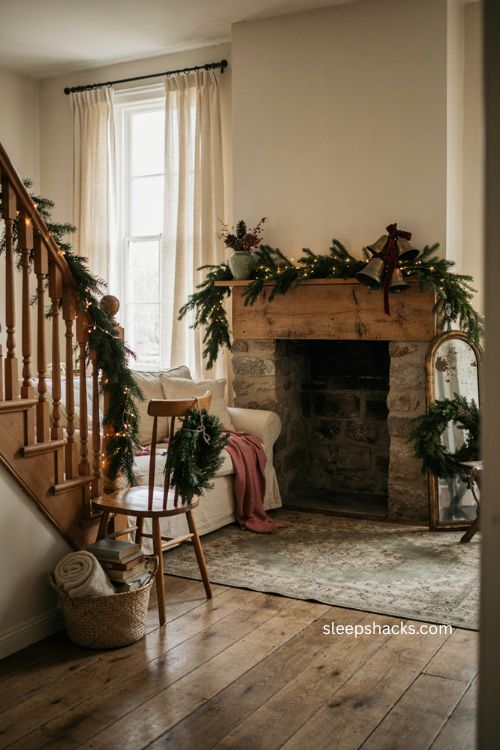 Layered Christmas garlands wreaths and warm string lights in a cozy home 