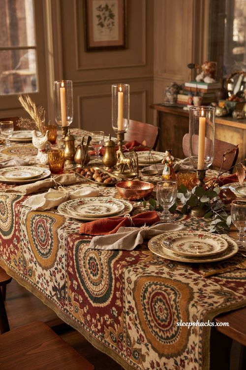 Layered Suzani Thanksgiving table with gold accents and eclectic decor 