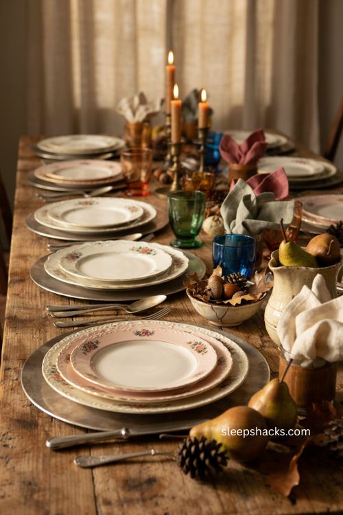Layered mismatched vintage china with pink floral plates for thanksgiving 