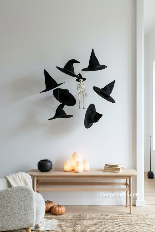 Minimalist floating witch hats and glowing ceramic ghosts with skeleton Halloween decor