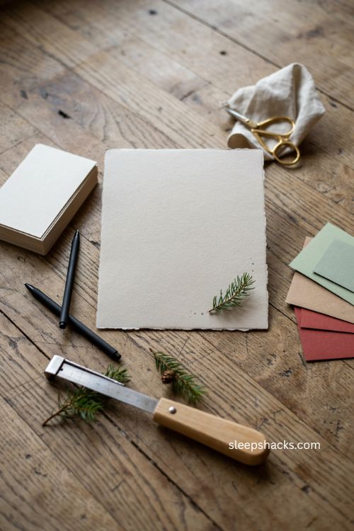 Minimalist printed sentiment Christmas card with heavy ivory cardstock evergreen sprig and clean simple design 