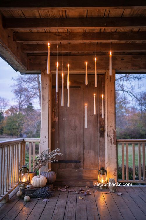 Mixing short and tall floating candles for dimensional Halloween porch decor 