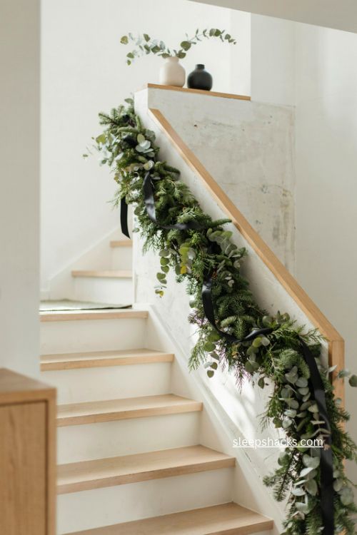 Modern christmas staircase garland with eucalyptus and black satin ribbon 