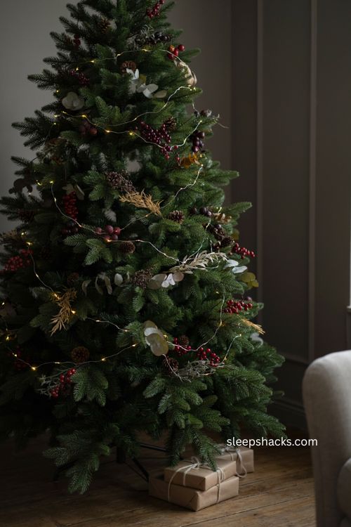 Moody Christmas garland with burgundy berry accents