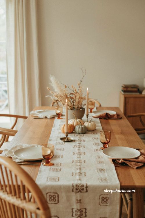 Neutral linen Thanksgiving table runner with subtle brown block print
