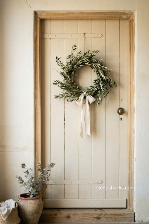 Olive branch Christmas wreath with simple cream ribbon for winter 