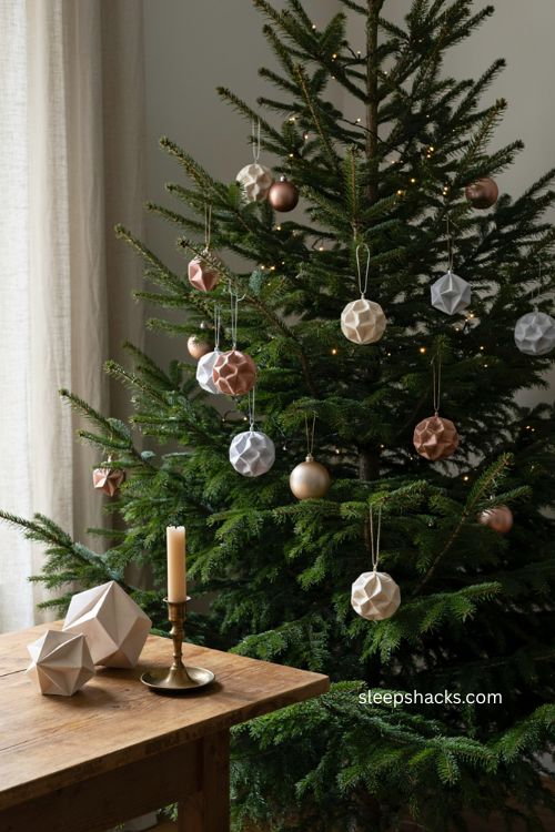 Origami geometric ornaments with metallic silver bronze and ivory folded paper christmas tree decorations 
