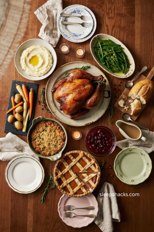 Overhead Thanksgiving turkey flat lay with centered roasted turkey and surrounding side dishes 