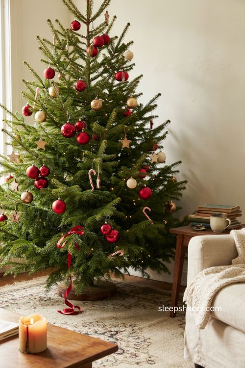 Oversized red ornaments on lime green Grinch Christmas tree 