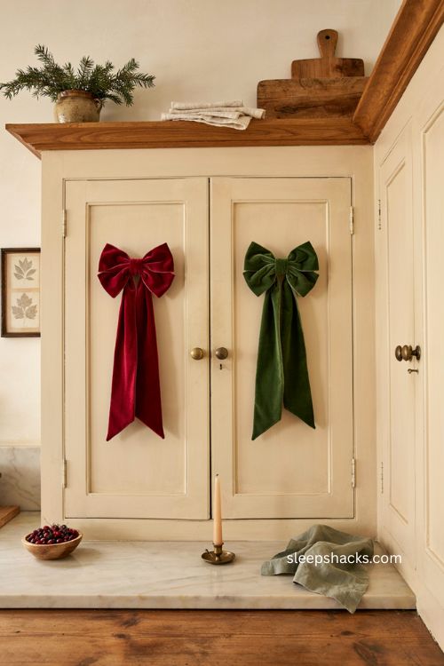 Oversized velvet bow Christmas decor on farmhouse kitchen cabinet doors