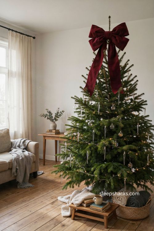 Oversized velvet bow on a clear icicle Christmas tree 