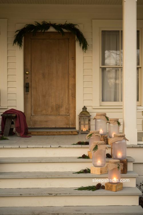 Painted mason jar lanterns for cozy Christmas porch decor 