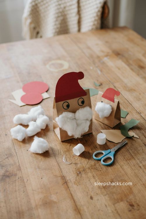 Paper bag Santa puppet Christmas craft for toddlers with cotton ball beard 