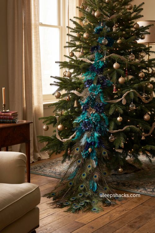 Peacock Christmas tree with muted ornaments metallic garland and cascading tail florals 