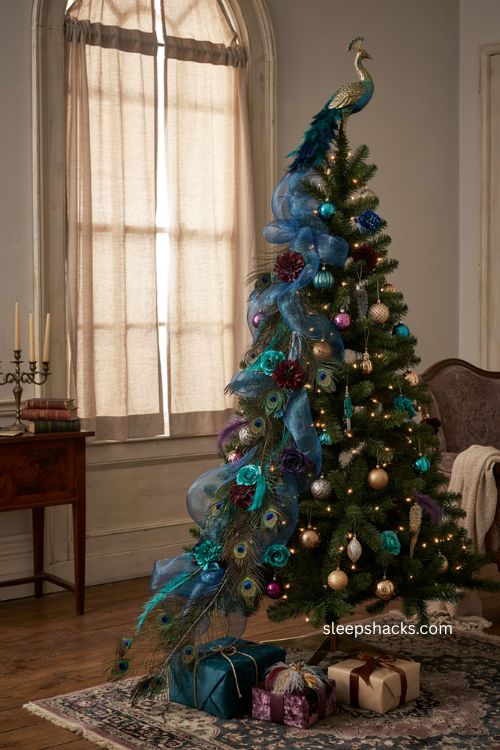 Peacock tail Christmas tree with cascading feathers blue deco mesh and jewel toned florals 