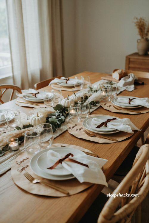 Personalized butcher paper Thanksgiving place cards with white napkins and brown ribbon