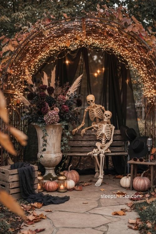 Photo ready backyard Halloween backdrop with skeletons dark florals and warm fairy lights 