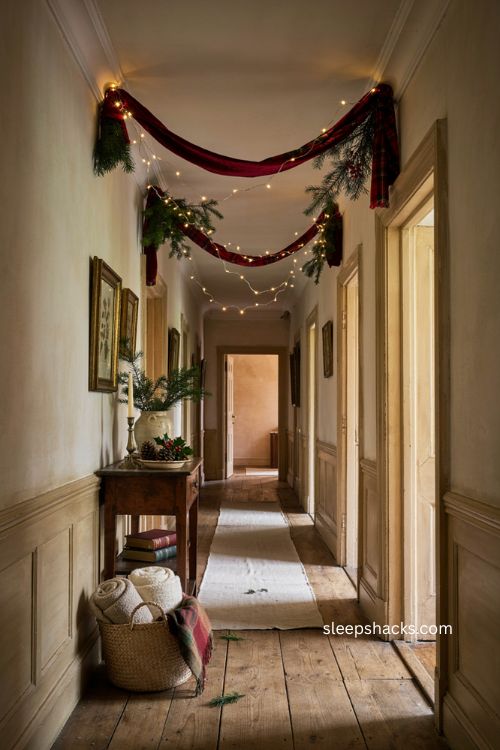 Red ribbon and Christmas lights on hallway ceiling 