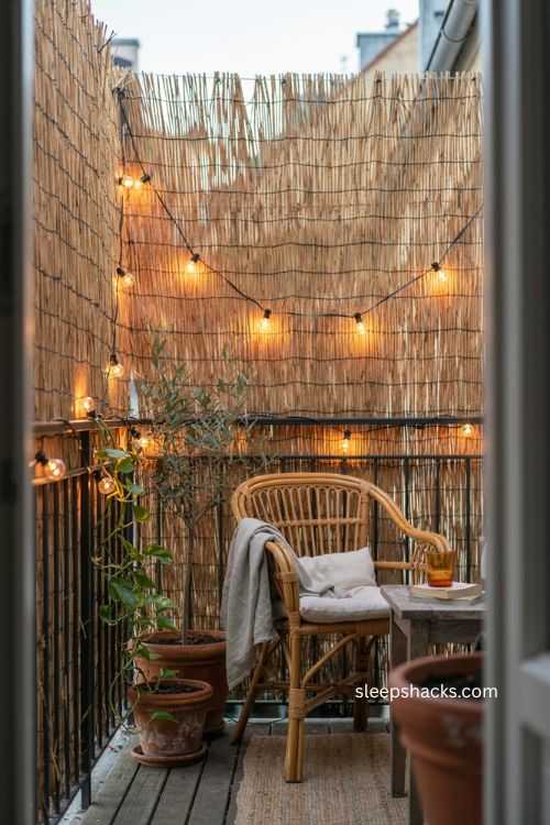 Reeded bamboo screening with string lights for cozy balcony privacy 