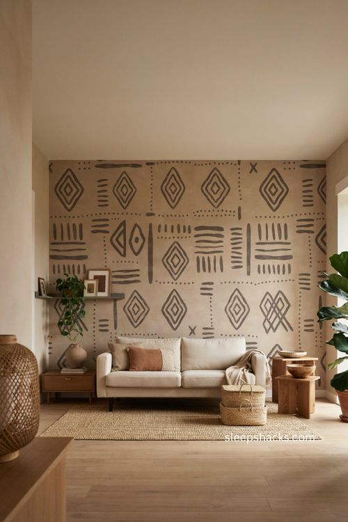 Renter friendly Afro boho living room with mud cloth statement wall and woven storage