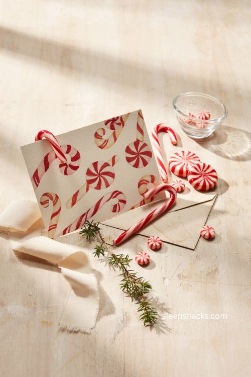 Retro candy cane Christmas card with red white peppermint swirls 