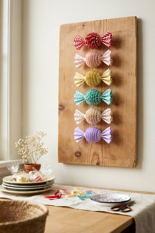 Ribbon candy wall piece with folded paper waves for a diy display 