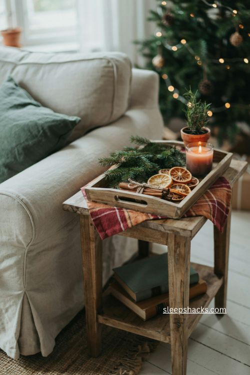 Rustic christmas end table decor with plaid pine cinnamon and dried oranges 