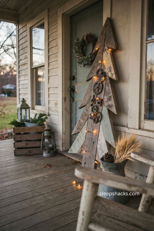 Rustic reclaimed wood christmas tree with rusty gears and vintage porch decor 