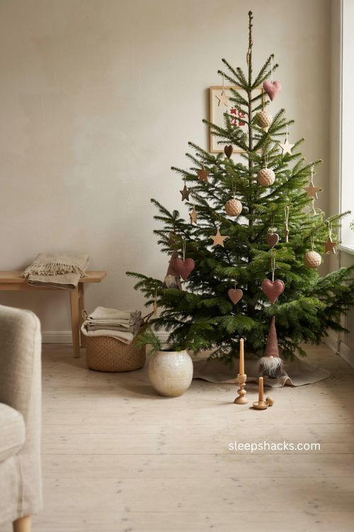 Scandinavian Christmas tree with wooden straw felt ornaments and Nordic gnomes