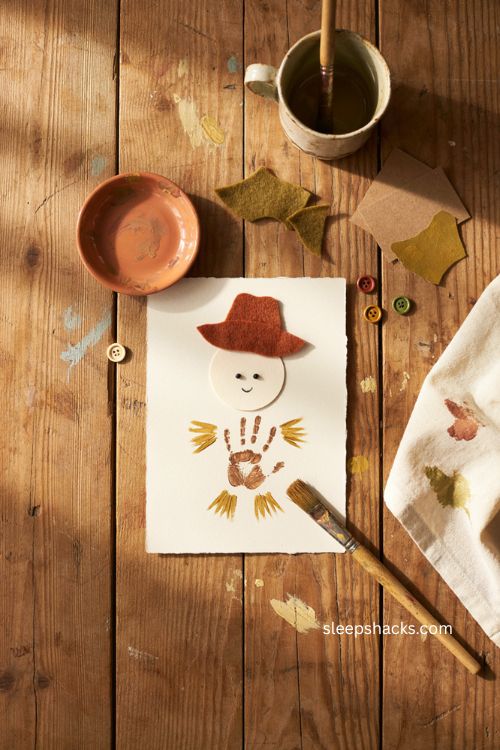 Scarecrow handprint craft with baby palm art for Thanksgiving 