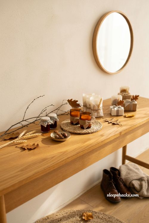 Small Thanksgiving send off gifts with candles cookies jam jars and simple autumn wrapping
