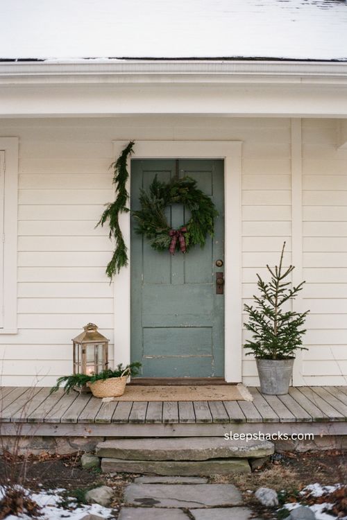 Small front porch Christmas decor ideas with cozy intentional farmhouse style 