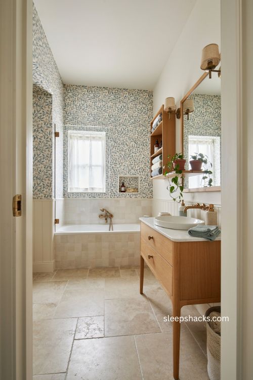 Small full bathroom ideas with smart storage bold wallpaper and compact tub