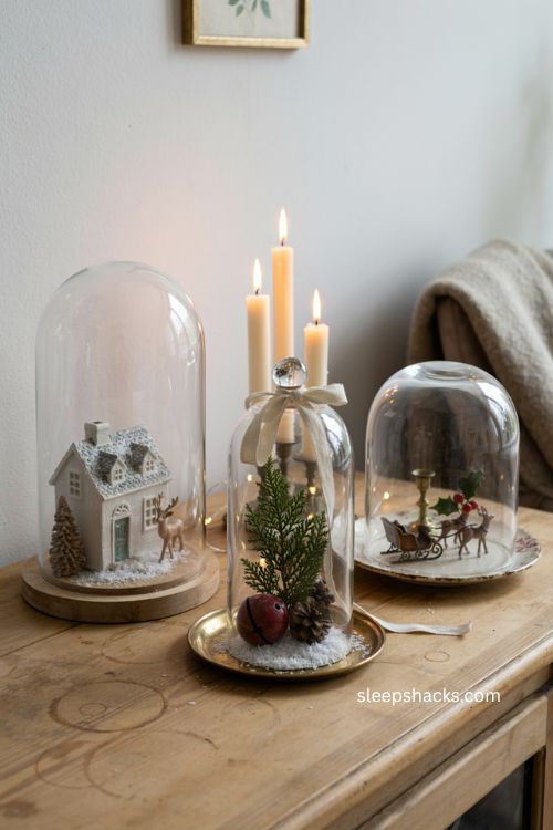 Snow globe cloche display with miniature christmas village decor 