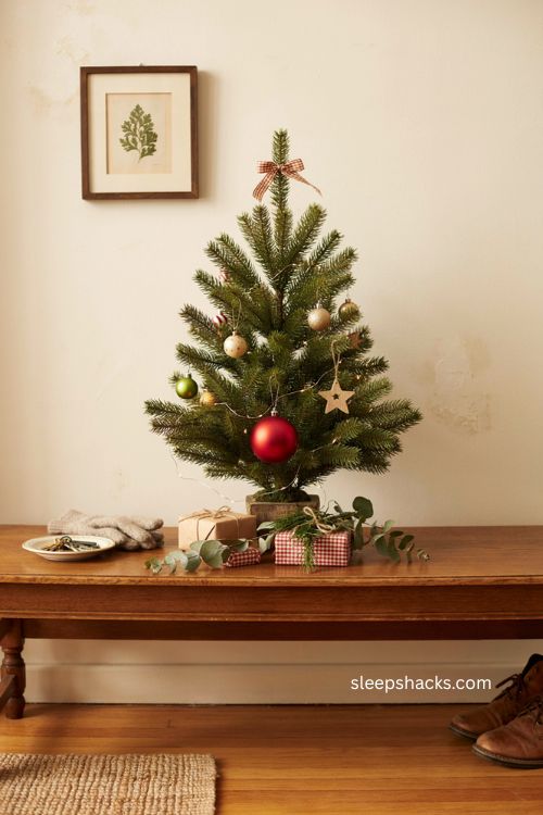 Tabletop mini Grinch Christmas tree with oversized ornament 