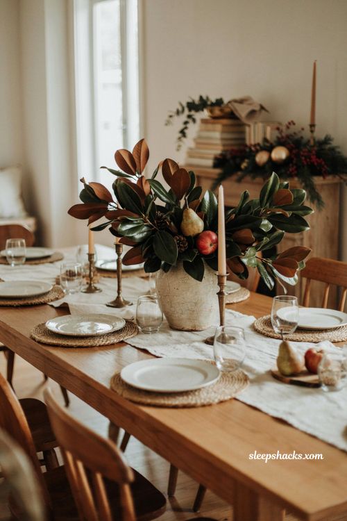 Thanksgiving Christmas decor with magnolia leaves pears apples and evergreen