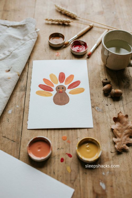 Thanksgiving baby footprint turkey keepsake craft with painted feathers 