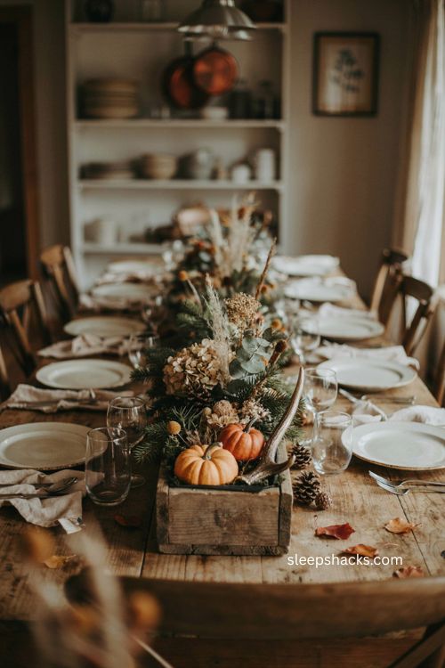 Thanksgiving centerpiece ideas with repurposed wooden window box pumpkins and greenery