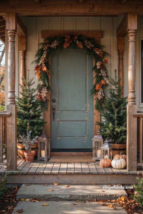 Thanksgiving front porch decor ideas with garlands mini trees and lanterns
