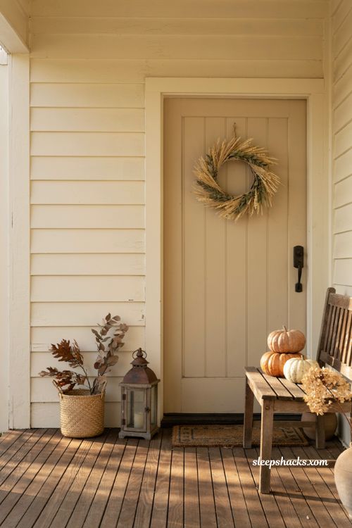 Thanksgiving front porch decor ideas with heirloom pumpkins and lanterns