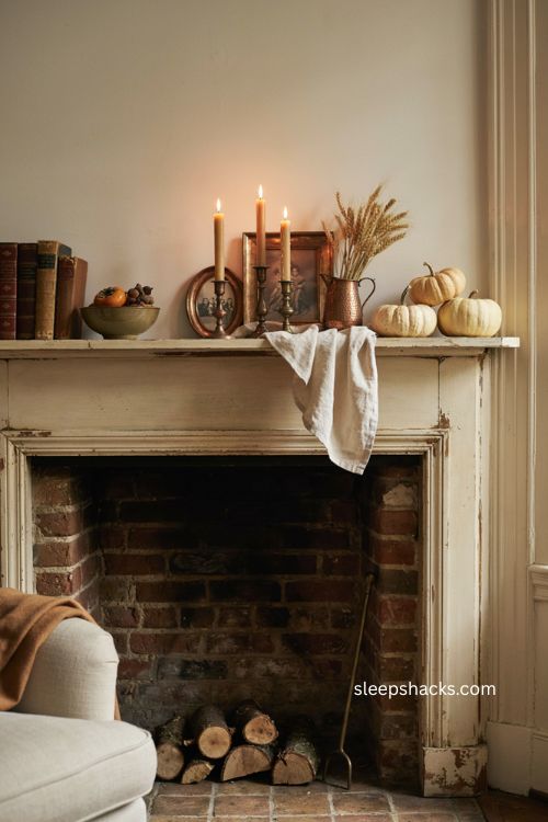 Thanksgiving mantel decor with copper candlesticks cream pumpkins dried wheat and warm accents 