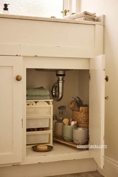 Under sink bathroom storage ideas with stackable bins baskets and sliding shelves 