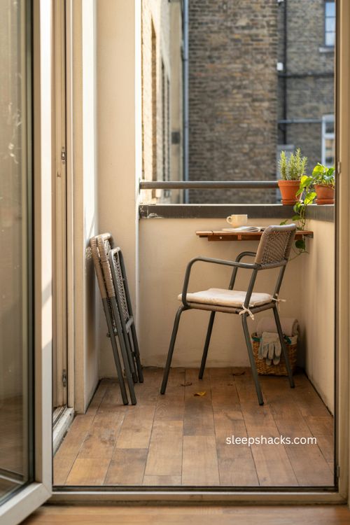 Very small balcony decor with foldable bistro chairs 